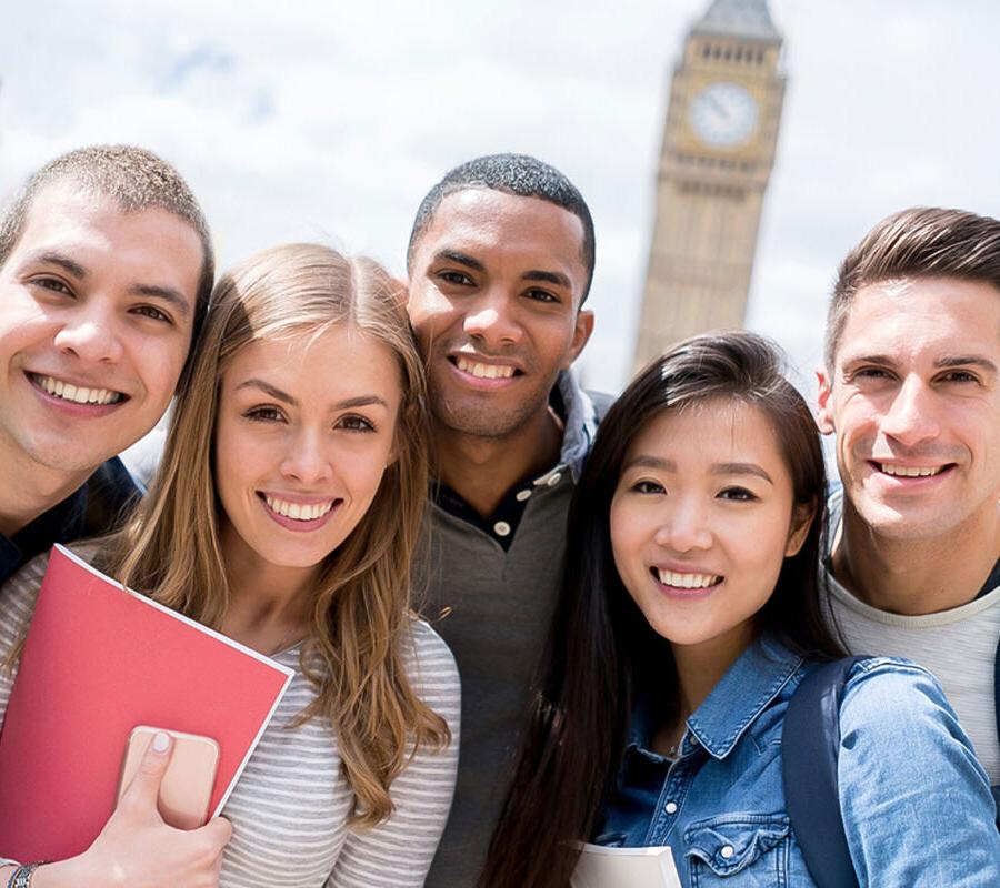 study abroad students standing in a group smiling